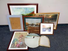 A box containing assorted framed pictures and prints, frameless circular bevel edged mirror,