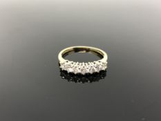 An 18ct gold seven stone diamond ring, size Q. CONDITION REPORT: 2.8g.