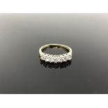 An 18ct gold seven stone diamond ring, size Q. CONDITION REPORT: 2.8g.