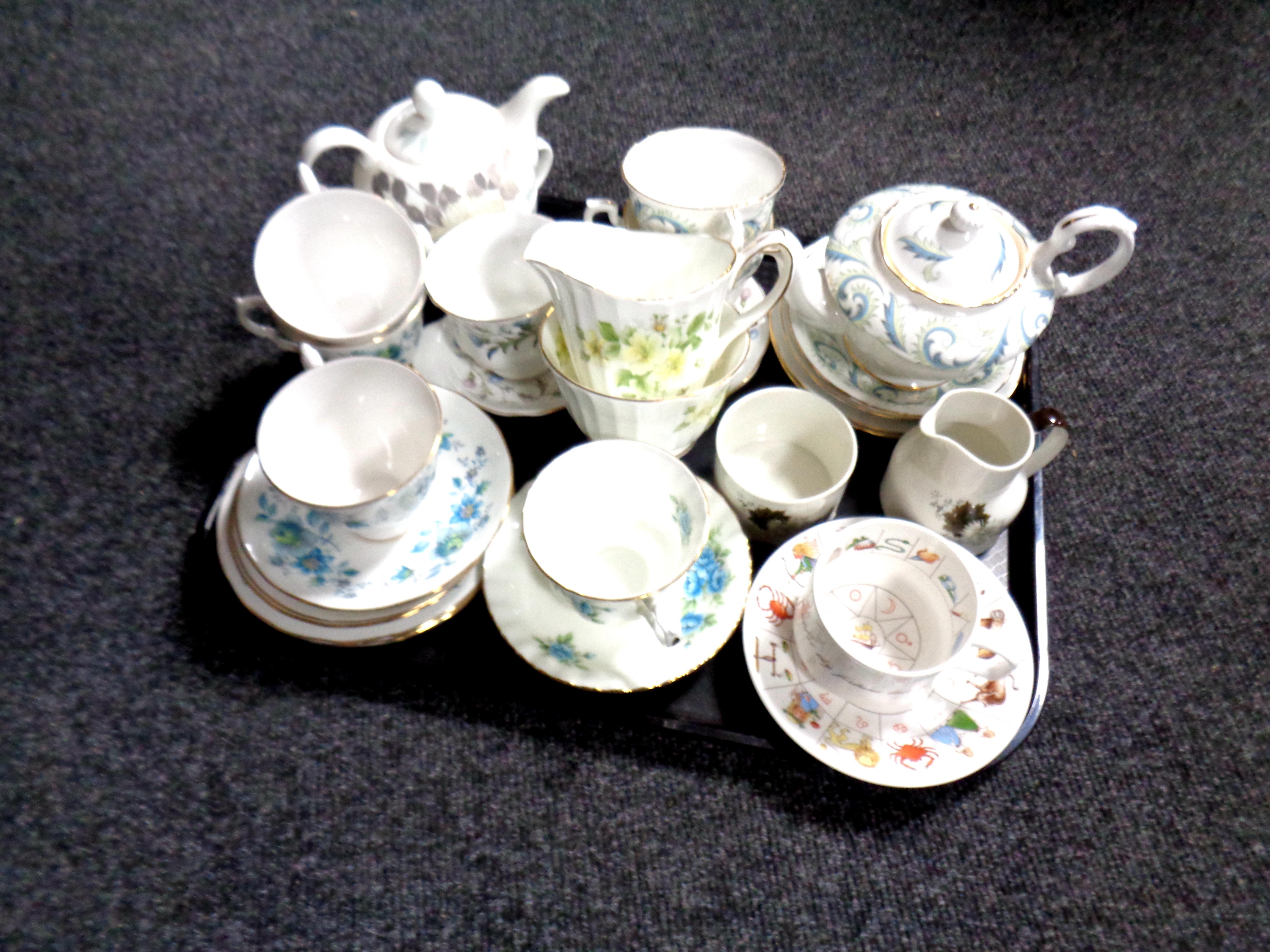 A tray containing assorted tea china to include a seven piece Royal Stafford garland tea for two,
