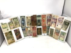 Four display frames containing world bank notes.