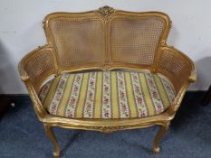A French gilt wood bergere backed window seat