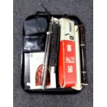 A tray containing cameras, music stand, Hohner melodica,