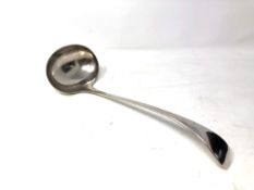 A large silver plated ladle