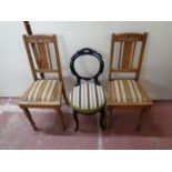 A pair of early 20th century oak dining chairs together with an ebonised bedroom chair