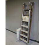 A set of wooden extension ladders,