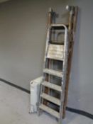 A set of wooden extension ladders,