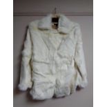 A white mink fur coat by Visual,