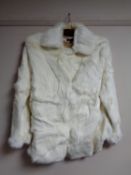 A white mink fur coat by Visual,