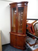 A Strong Bow Furniture double door glazed corner cabinet,