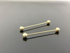 A pair of collar pins