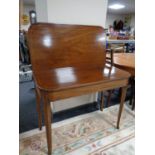 A 19th century inlaid mahogany turnover top tea table