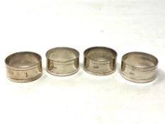 Four silver plated napkin rings