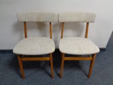 A pair of 20th century teak dining chairs
