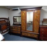 A late 19th century three piece bedroom suite comprising of mirror door wardrobe,