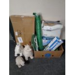 A box of new gardening equipment to include coil hose, water cannon, fish pond protector,