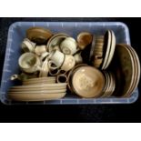 A box containing assorted Denby dinner ware