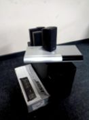 A Bose surround sound system with sub woofer together with a Bose lifestyle VS-2 video enhancer,