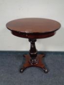 An antique continental pedestal work table