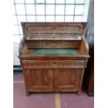 A 19th century mahogany roll front bureau