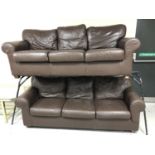 Two brown leather three seater settee's (arm damaged)