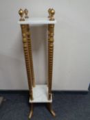 A gilt and marble two tier plant stand