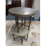 Two folding eastern brass topped tables