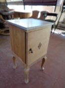 A stripped pine marble topped pot cupboard