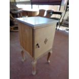 A stripped pine marble topped pot cupboard