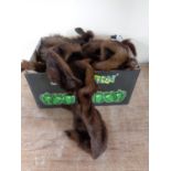 A box containing assorted mink and fox fur stoles