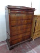 A 19th century continental mahogany seven drawer chest