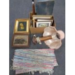 A box containing vintage luggage case, assorted pictures, wooden table lamp,