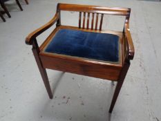 An Edwardian storage piano seat