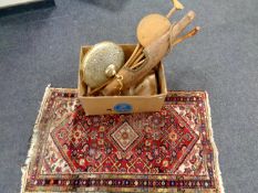 A box containing walking stick, yoke, Persian rug, brass and glass light fitting,