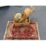 A box containing walking stick, yoke, Persian rug, brass and glass light fitting,