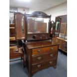 An Edwardian mahogany dressing chest with triple mirror