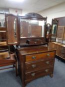 An Edwardian mahogany dressing chest with triple mirror