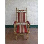 A blonde oak bobbin American style rocking chair