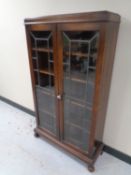 An Edwardian oak leaded glass double door bookcase