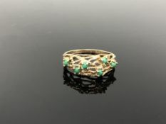 A 9ct gold textured ring set with turquoise, size P. CONDITION REPORT: 2.
