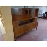A mid 20th century teak sideboard fitted cupboards and drawers on raised legs