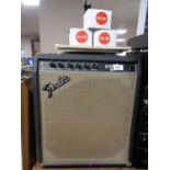 A Fender Sidekick Bass 30 guitar amplifier together with three Fender and Epiphone amp foot
