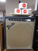 A Fender Sidekick Bass 30 guitar amplifier together with three Fender and Epiphone amp foot