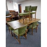 An early 20th century continental pull out dining table on bulbous legs together with a set of six