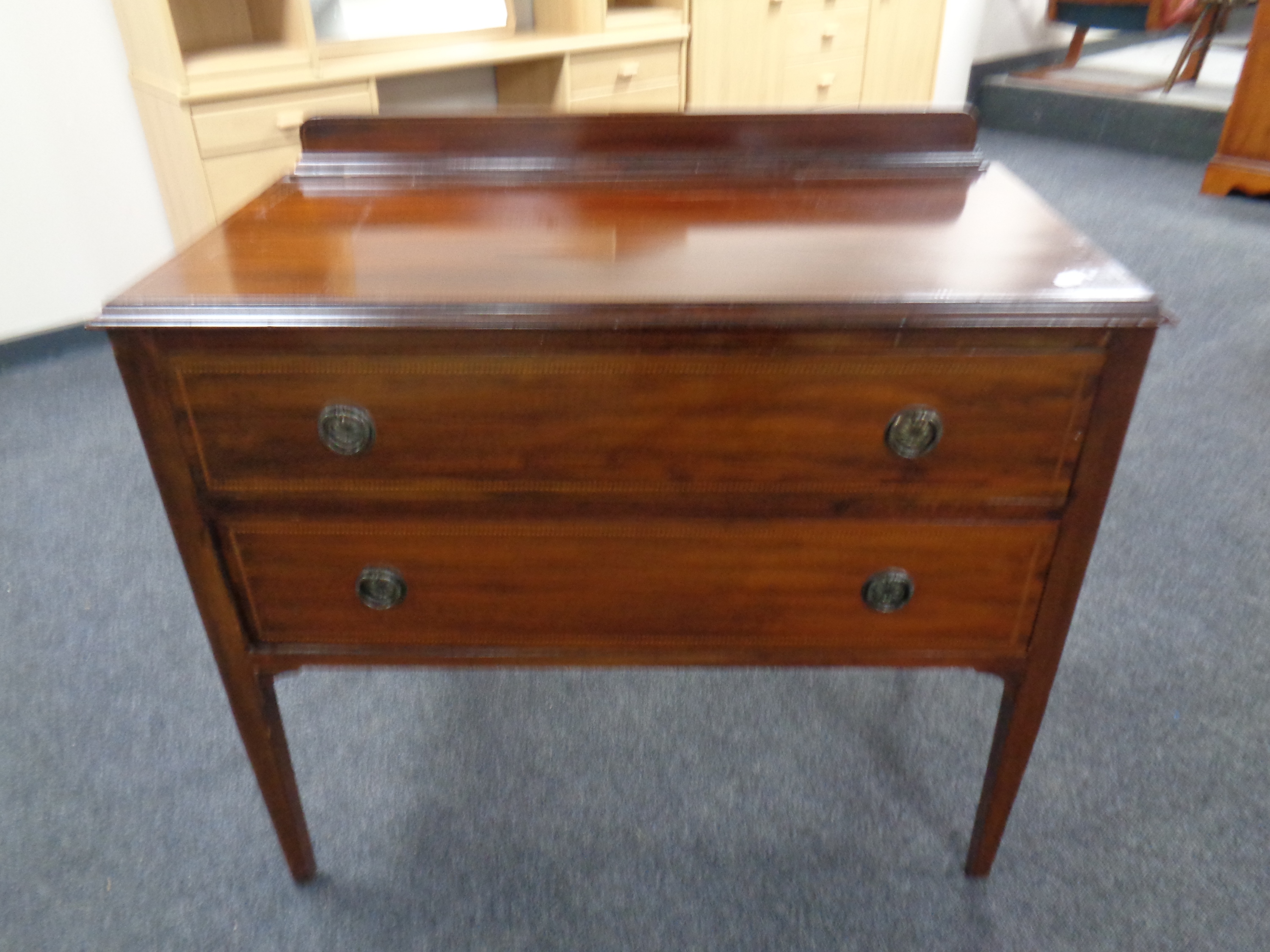 An Edwardian inlaid two drawer chest