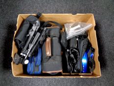 A box containing video cameras in bags, assorted cameras to include Olympus, Garmin sat nav,