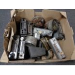 A box of vintage car radios and speedometers