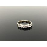 A 9ct gold half eternity ring