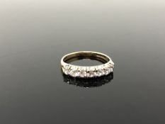 A 9ct gold half eternity ring