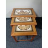 A nest of three 20th century Mobel Fabrikken Danish teak tile topped tables